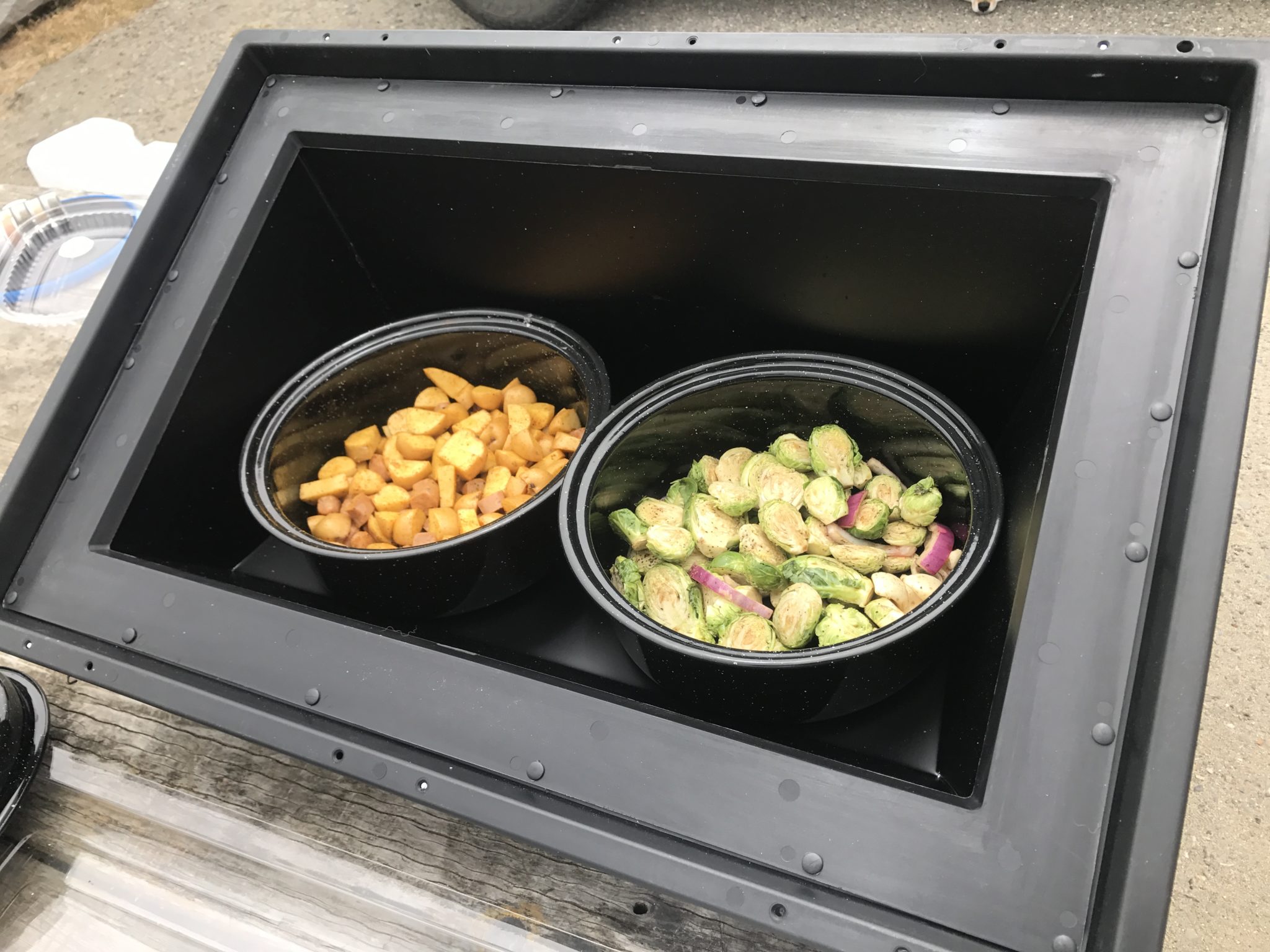 This solar kitchen comes with a pot and a solar-cooking device